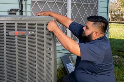 Baytown TX HVAC tech installing air conditioner